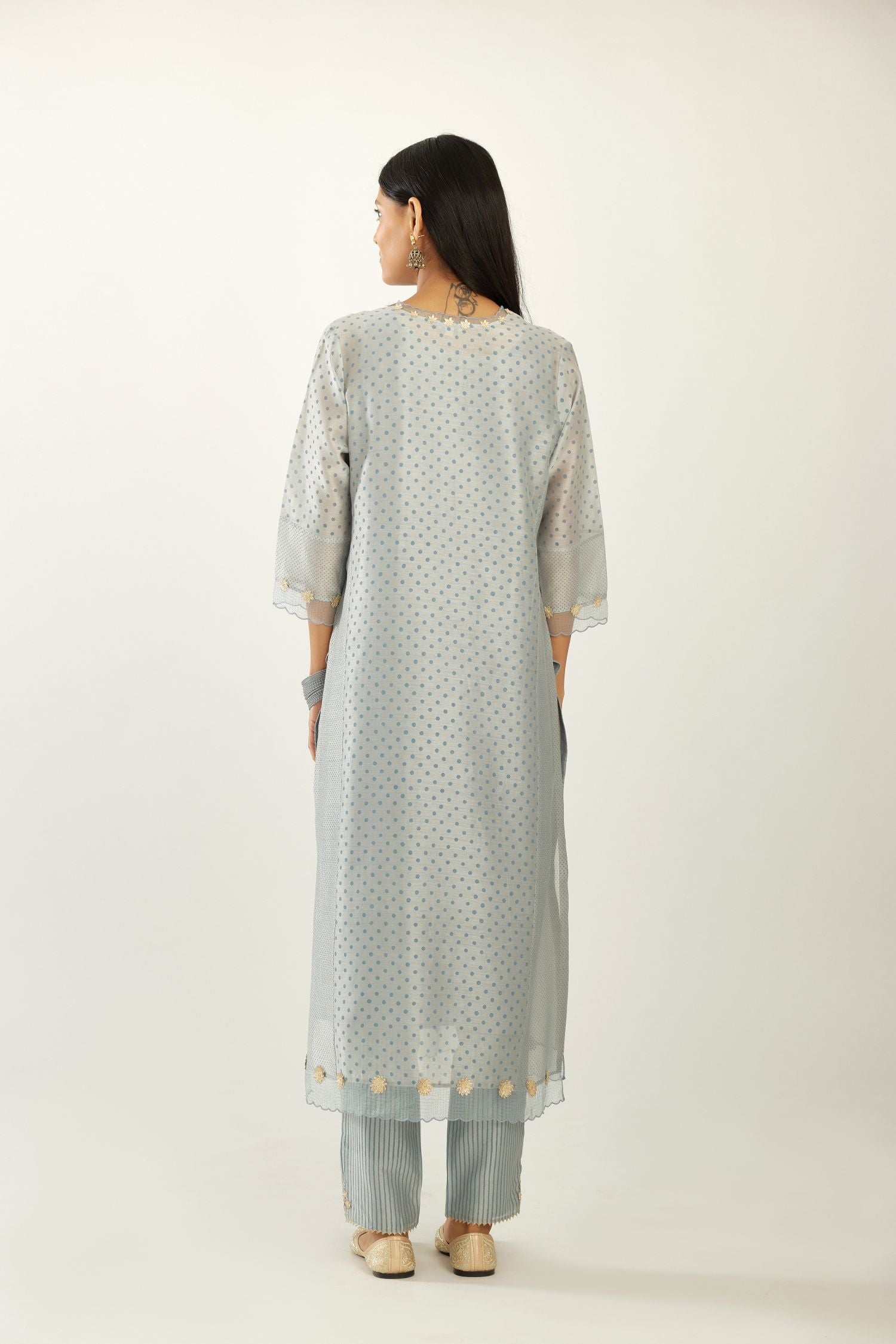 Blue hand block printed silk chanderi kurta set with concealed button placket neckline, Highlighted with gota flower and scalloped organza at edges.