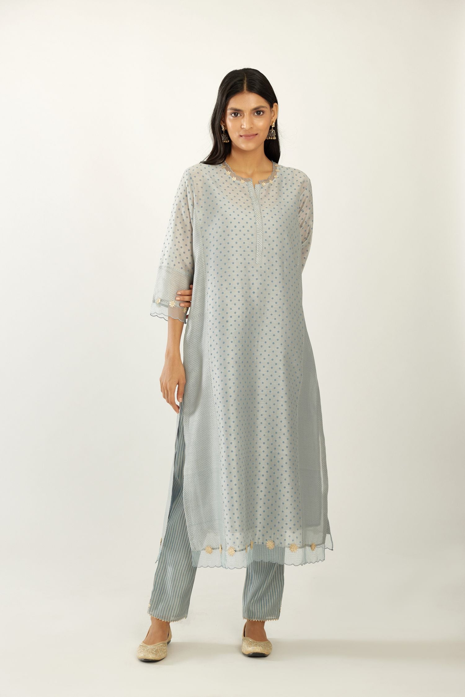 Blue hand block printed silk chanderi kurta set with concealed button placket neckline, Highlighted with gota flower and scalloped organza at edges.