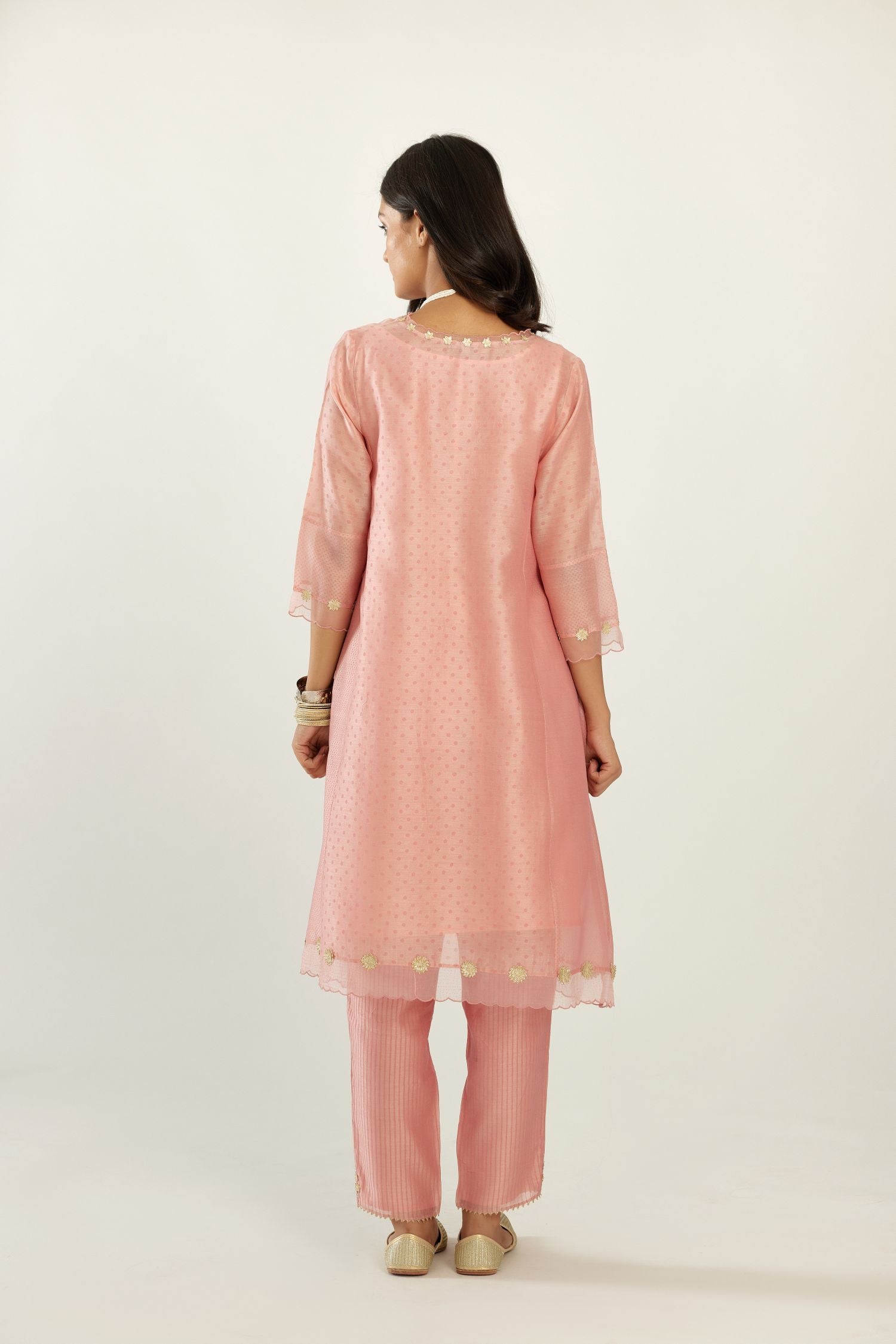 Pink A-line hand block printed silk chanderi short kurta set, highlighted with gota flower embroidery.