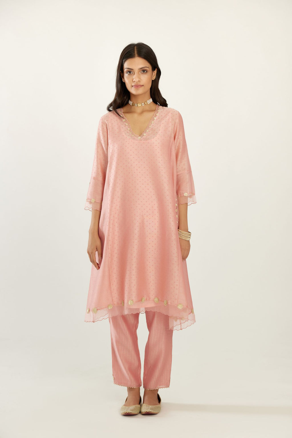 Pink A-line hand block printed silk chanderi short kurta set, highlighted with gota flower embroidery.