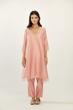 Pink A-line hand block printed silk chanderi short kurta set, highlighted with gota flower embroidery.