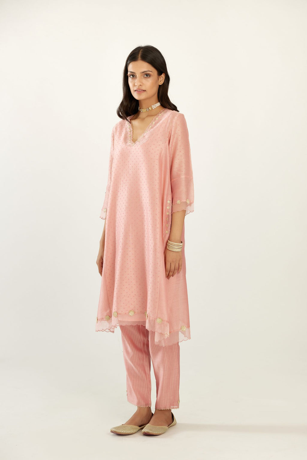 Pink A-line hand block printed silk chanderi short kurta set, highlighted with gota flower embroidery.