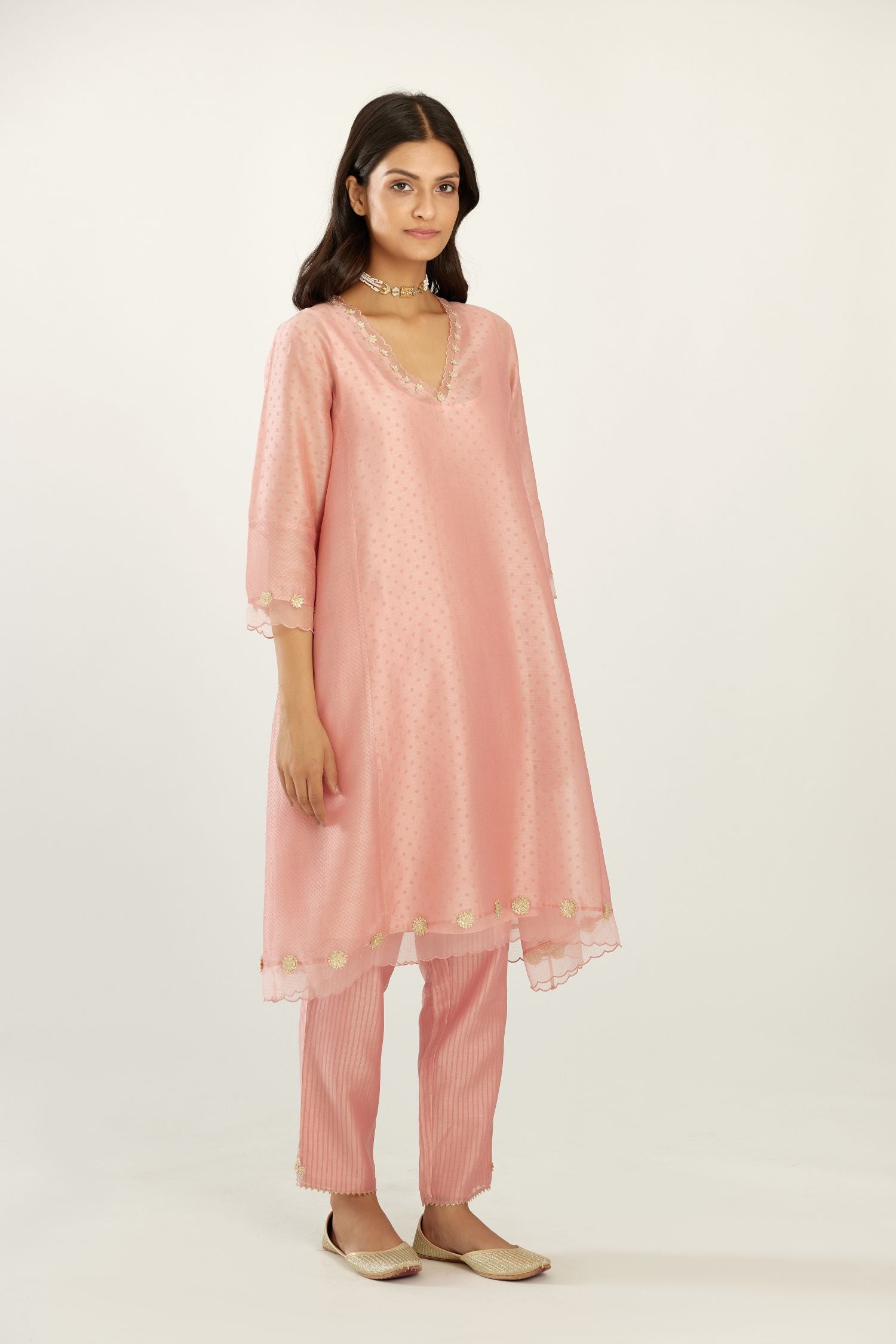 Pink A-line hand block printed silk chanderi short kurta set, highlighted with gota flower embroidery.