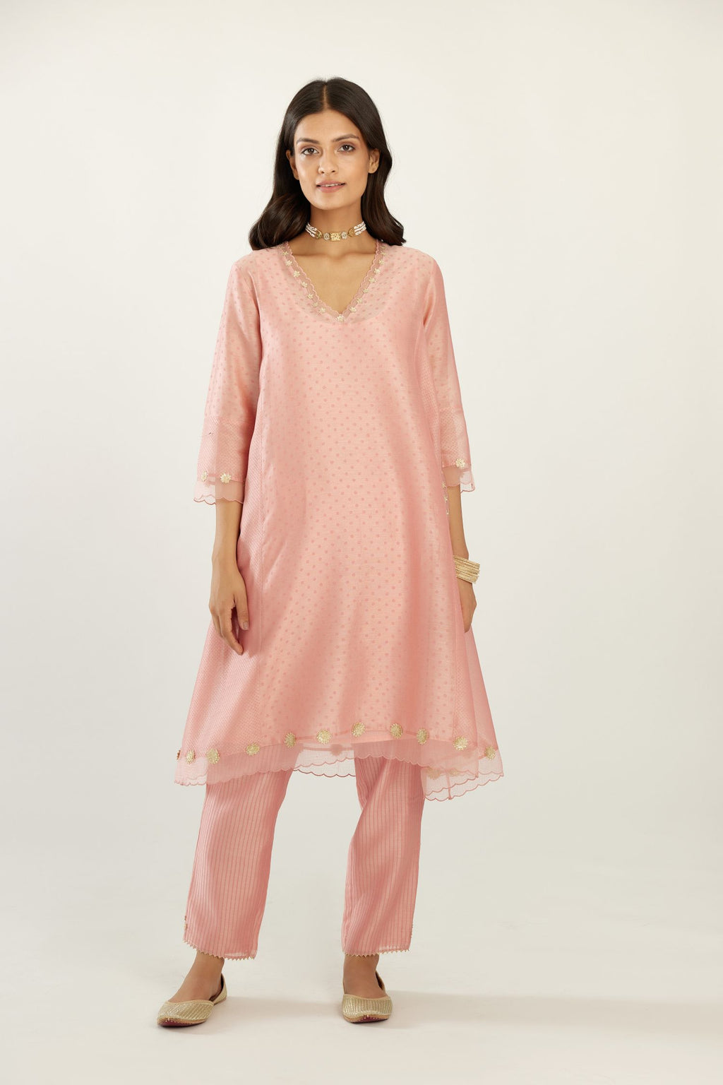Pink A-line hand block printed silk chanderi short kurta set, highlighted with gota flower embroidery.