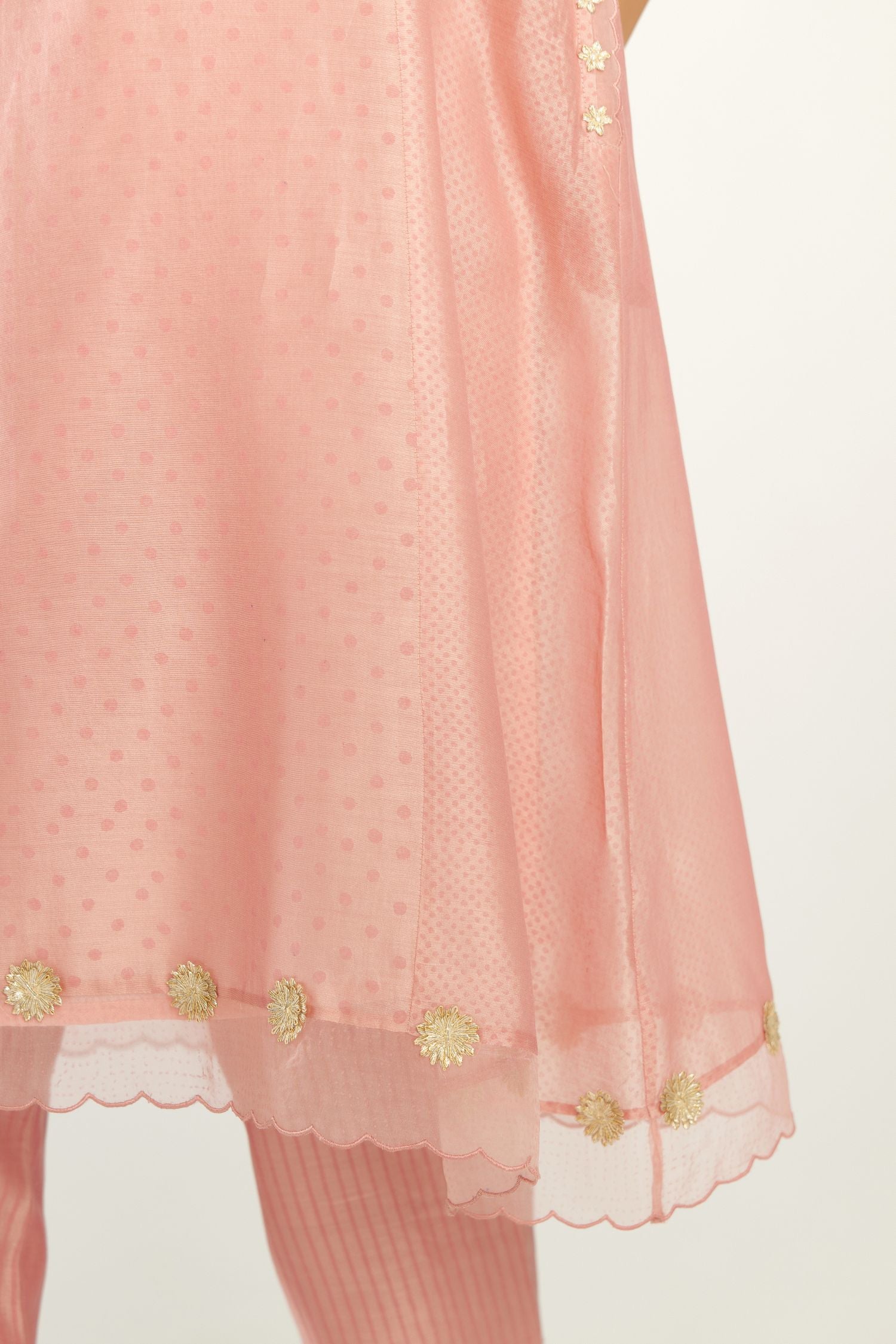 Pink A-line hand block printed silk chanderi short kurta set, highlighted with gota flower embroidery.