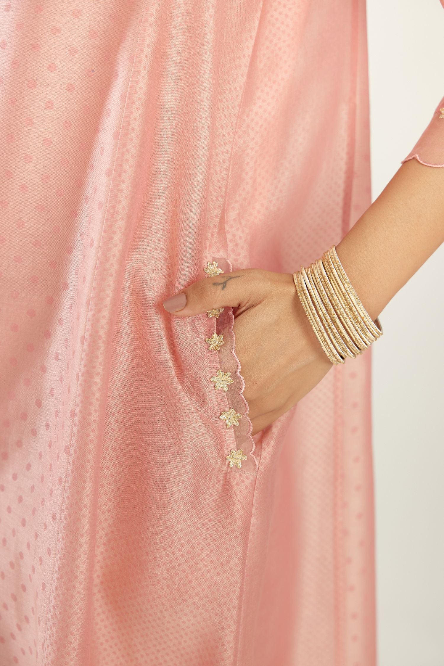 Pink A-line hand block printed silk chanderi short kurta set, highlighted with gota flower embroidery.