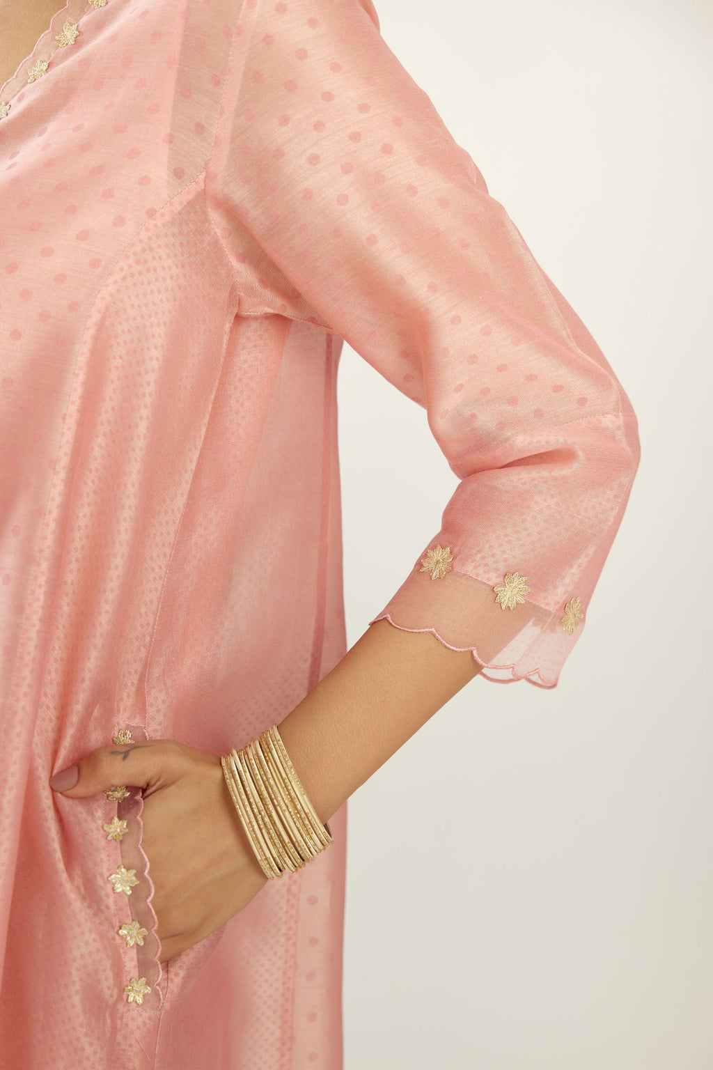 Pink A-line hand block printed silk chanderi short kurta set, highlighted with gota flower embroidery.