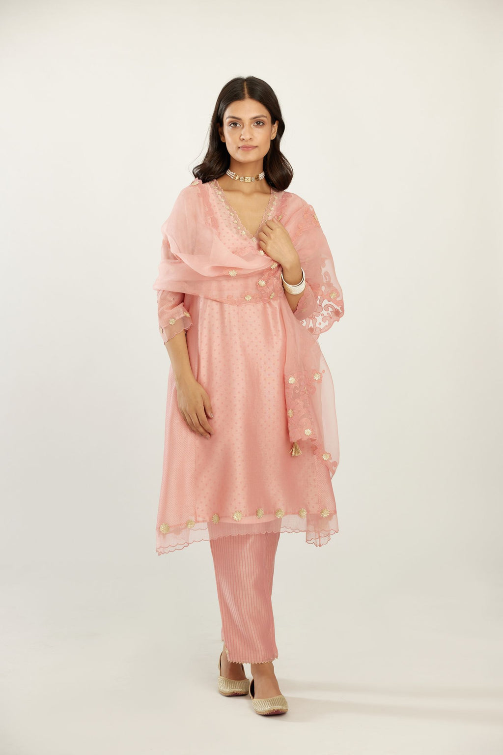 Pink A-line hand block printed silk chanderi short kurta set, highlighted with gota flower embroidery.
