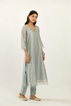 Blue silk chanderi hand block printed straight kurta set, highlighted with organza and gota embroidered flower at edges