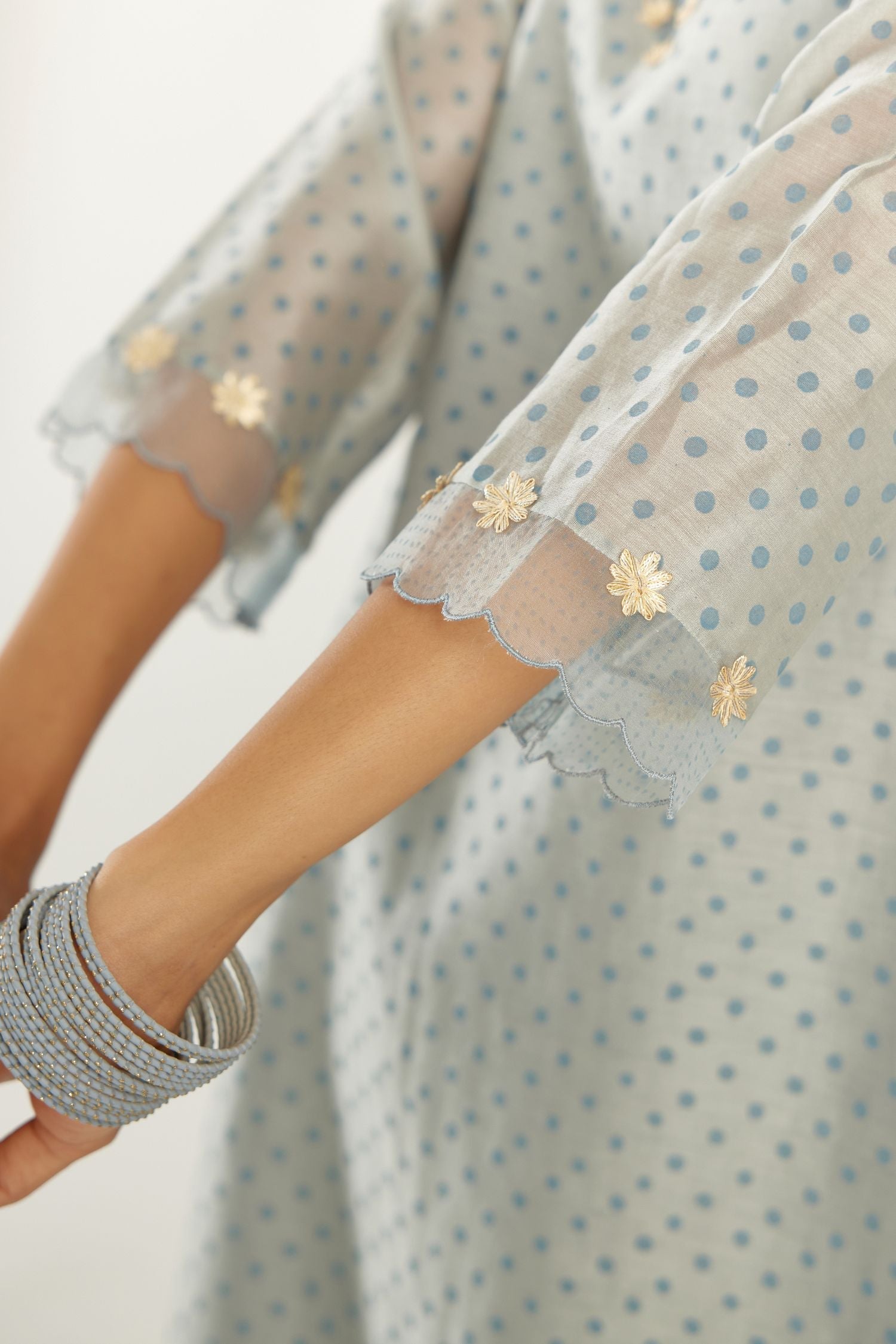 Blue silk chanderi hand block printed straight kurta set, highlighted with organza and gota embroidered flower at edges