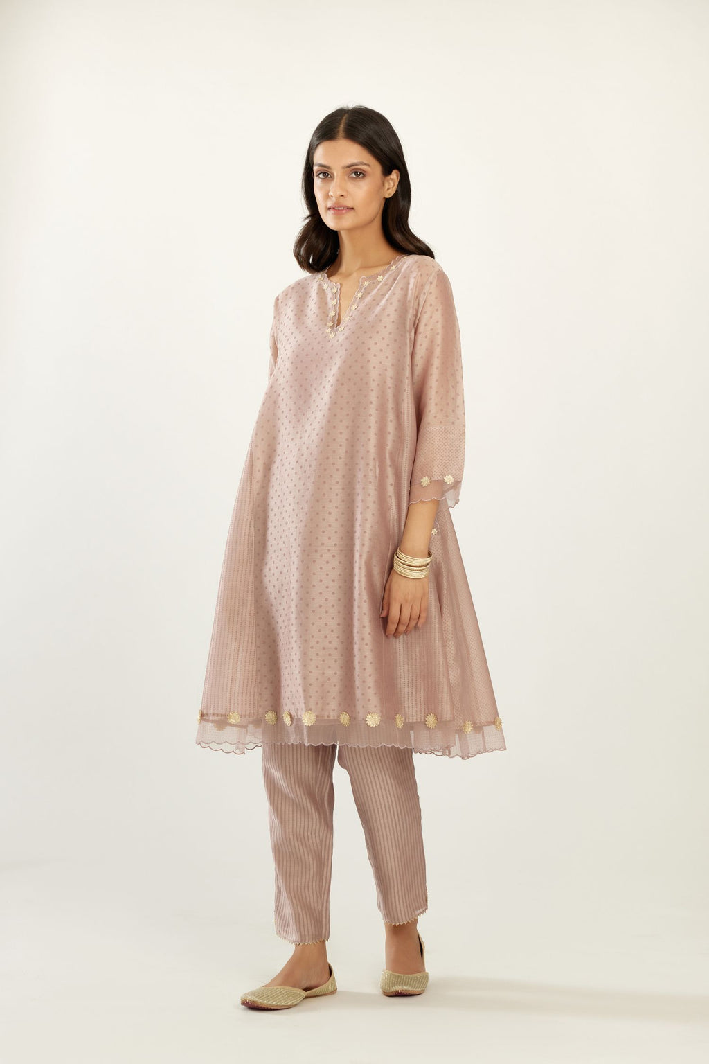 Lilac hand block printed silk chanderi easy fit short kurta set, highlighted with gota flower and scalloped organza at edges.