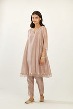 Lilac hand block printed silk chanderi easy fit short kurta set, highlighted with gota flower and scalloped organza at edges.