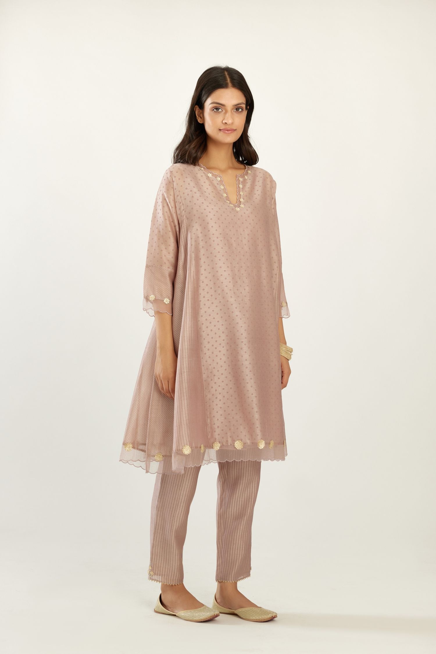 Lilac hand block printed silk chanderi easy fit short kurta set, highlighted with gota flower and scalloped organza at edges.