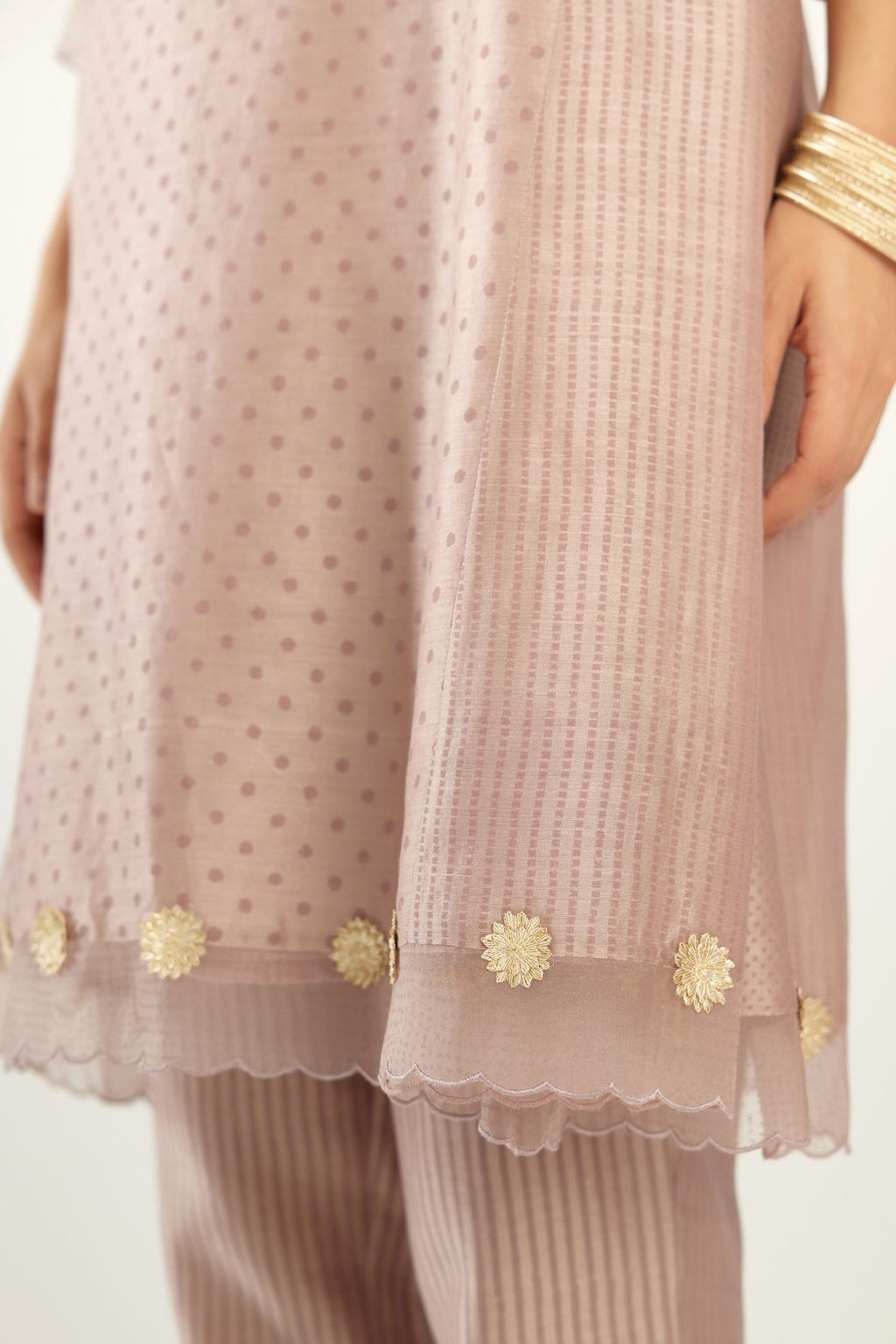 Lilac hand block printed silk chanderi easy fit short kurta set, highlighted with gota flower and scalloped organza at edges.