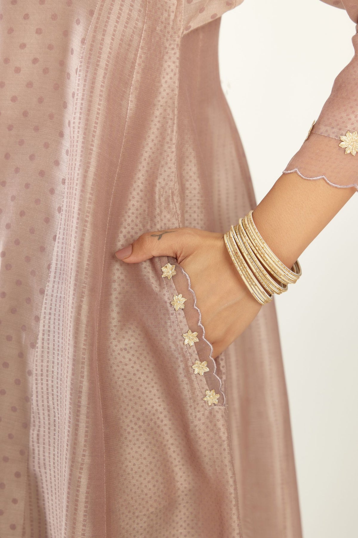 Lilac hand block printed silk chanderi easy fit short kurta set, highlighted with gota flower and scalloped organza at edges.