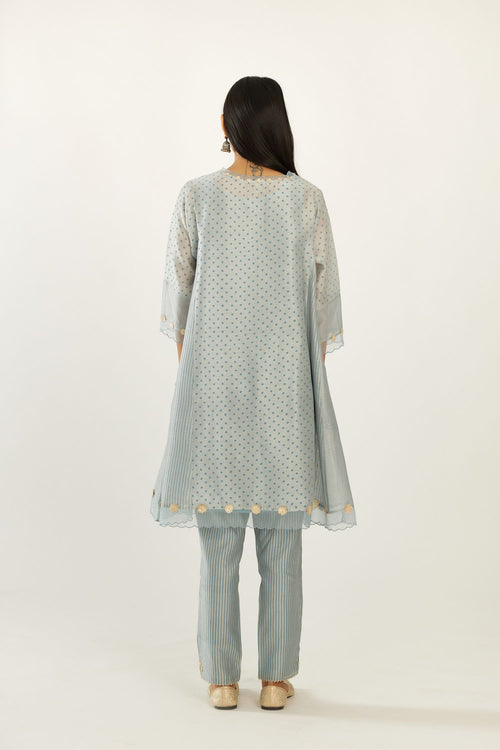 Blue hand block printed silk chanderi easy fit short kurta set, highlighted with gota flower and scalloped organza at edges.