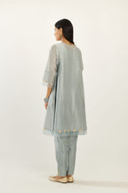 Blue hand block printed silk chanderi easy fit short kurta set, highlighted with gota flower and scalloped organza at edges.
