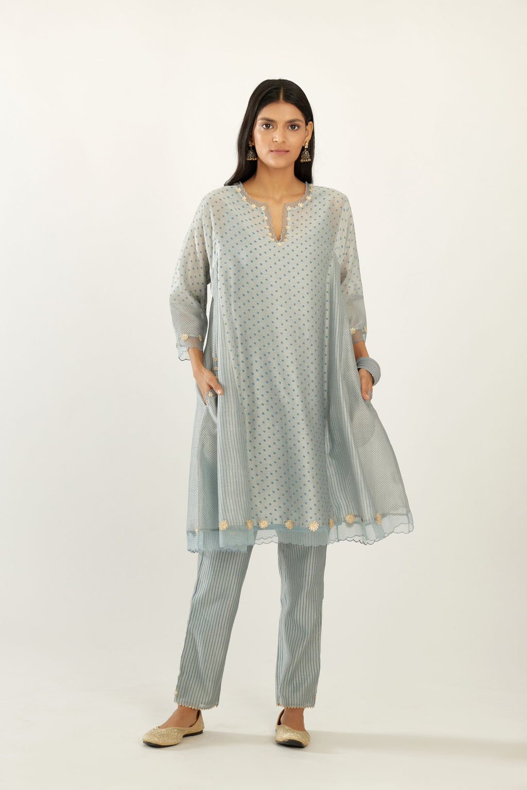 Blue hand block printed silk chanderi easy fit short kurta set, highlighted with gota flower and scalloped organza at edges.