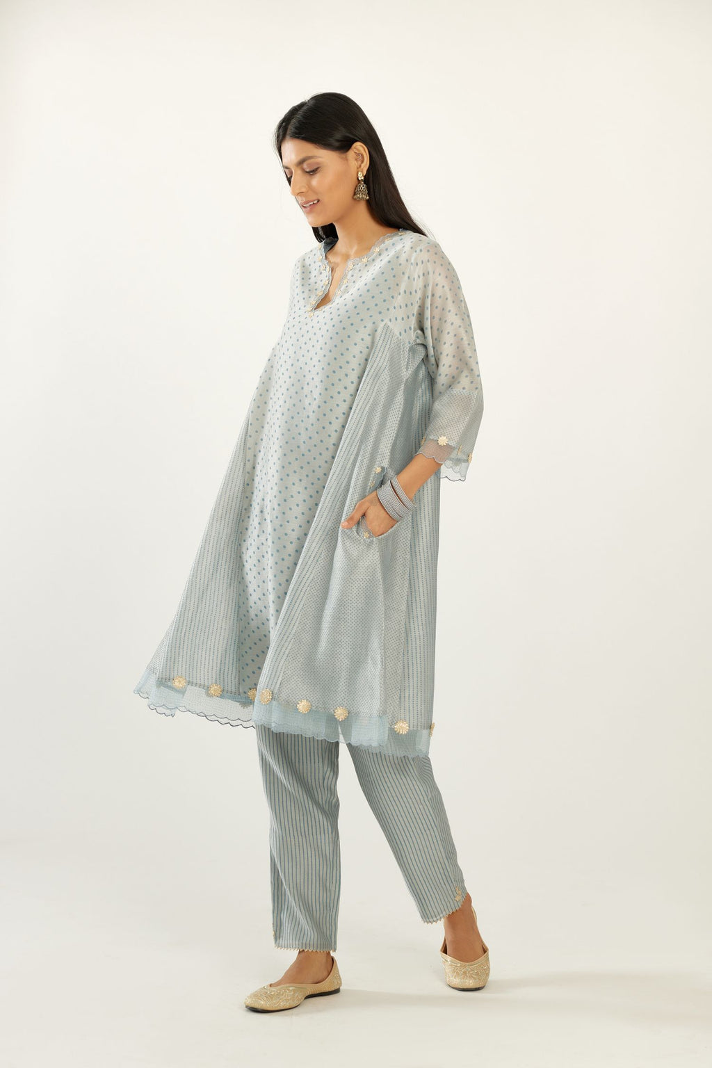 Blue hand block printed silk chanderi easy fit short kurta set, highlighted with gota flower and scalloped organza at edges.