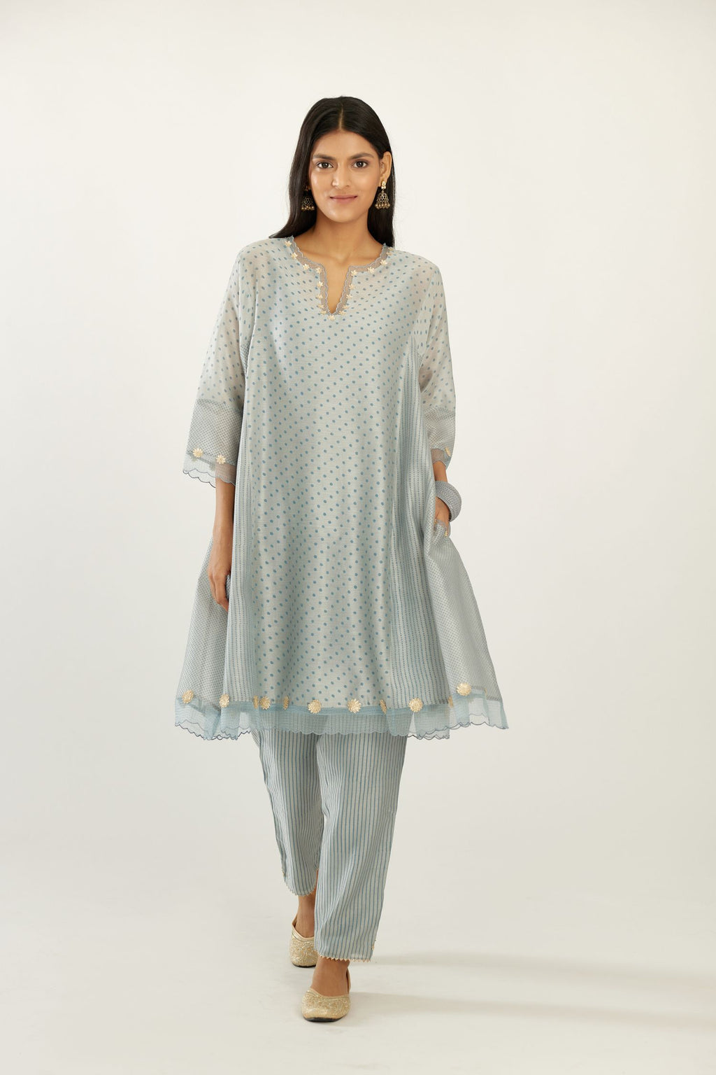 Blue hand block printed silk chanderi easy fit short kurta set, highlighted with gota flower and scalloped organza at edges.