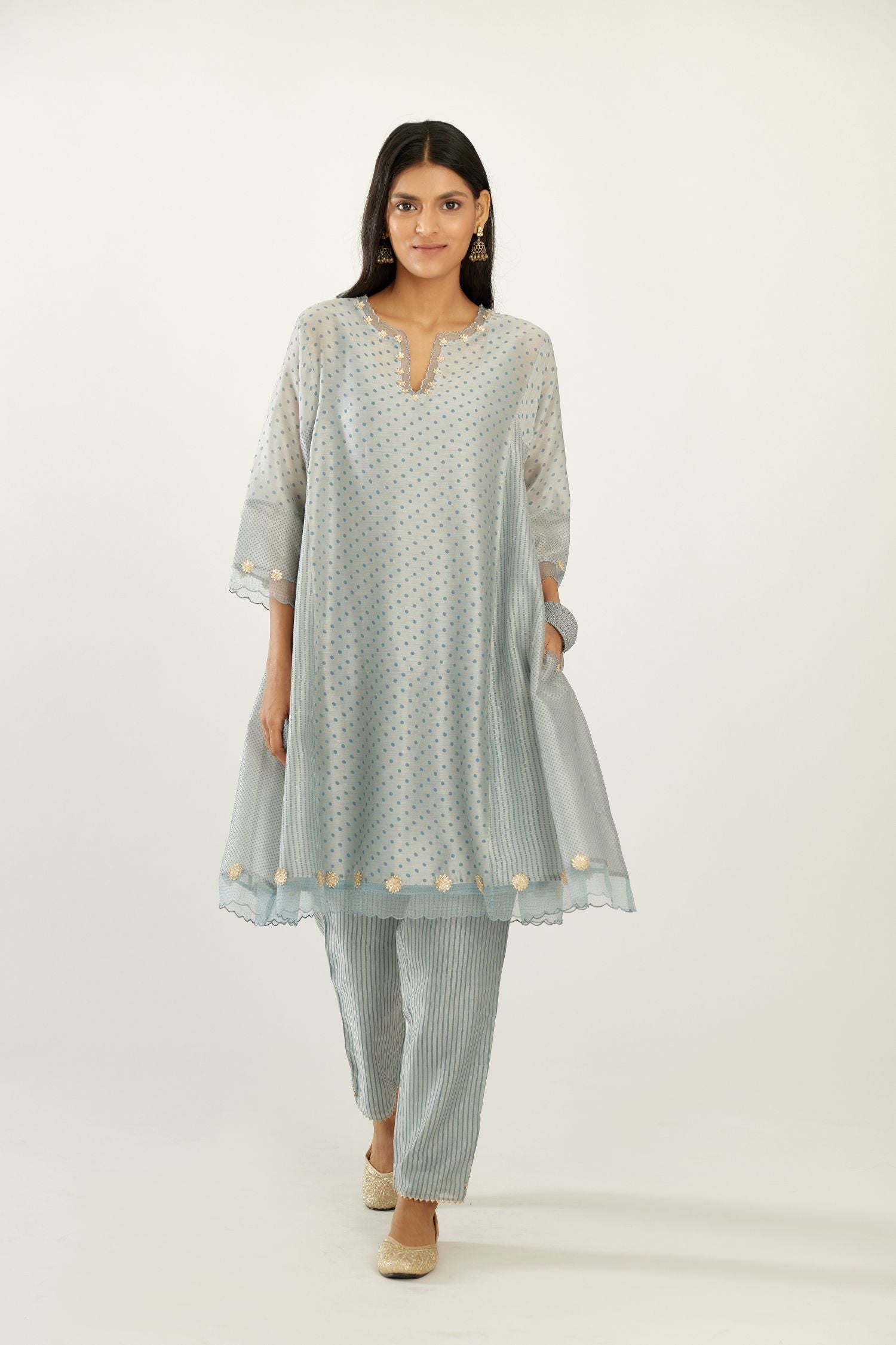 Blue hand block printed silk chanderi easy fit short kurta set, highlighted with gota flower and scalloped organza at edges.