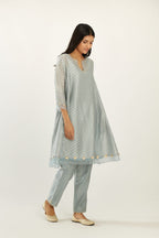 Blue hand block printed silk chanderi easy fit short kurta set, highlighted with gota flower and scalloped organza at edges.