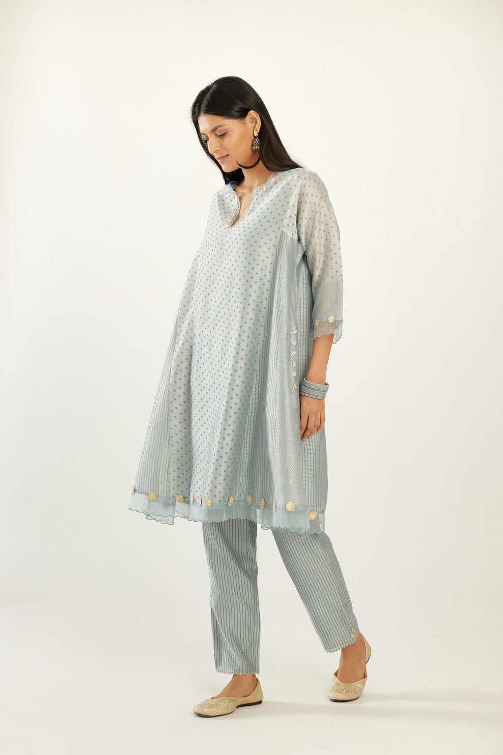 Blue hand block printed silk chanderi easy fit short kurta set, highlighted with gota flower and scalloped organza at edges.