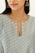 Blue hand block printed silk chanderi easy fit short kurta set, highlighted with gota flower and scalloped organza at edges.