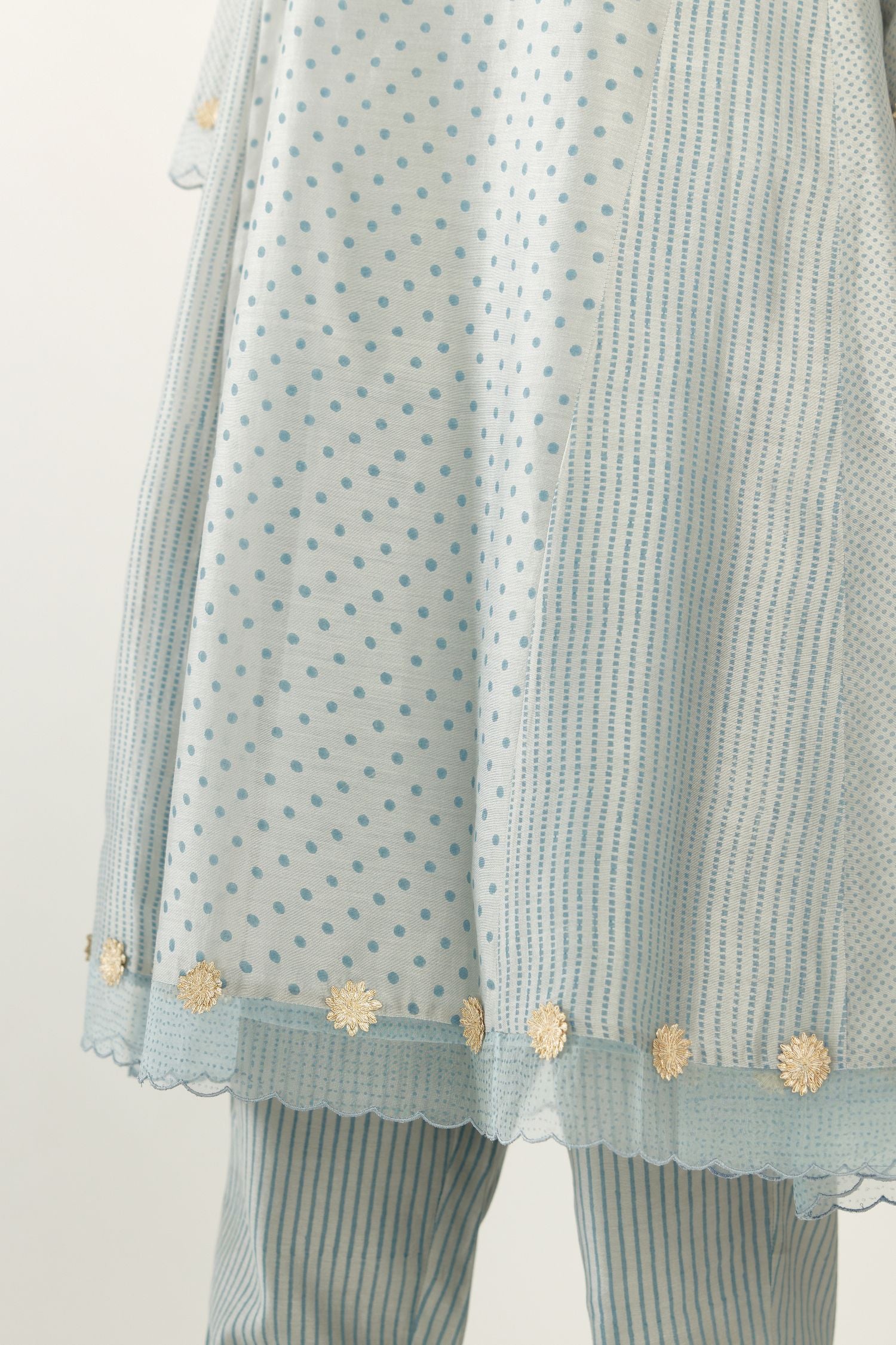 Blue hand block printed silk chanderi easy fit short kurta set, highlighted with gota flower and scalloped organza at edges.