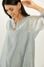 Blue hand block printed silk chanderi easy fit short kurta set, highlighted with gota flower and scalloped organza at edges.