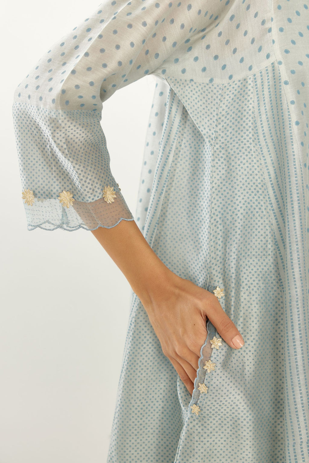 Blue hand block printed silk chanderi easy fit short kurta set, highlighted with gota flower and scalloped organza at edges.