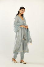 Blue hand block printed V neck gathered kurta set, highlighted with gota flower embroidery and scalloped organza at edges.