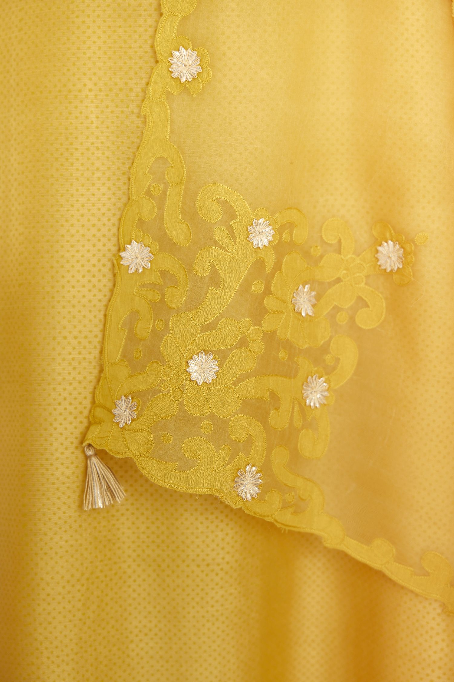 Yellow silk chanderi hand block printed straight kurta set, highlighted with scalloped organza at edges.