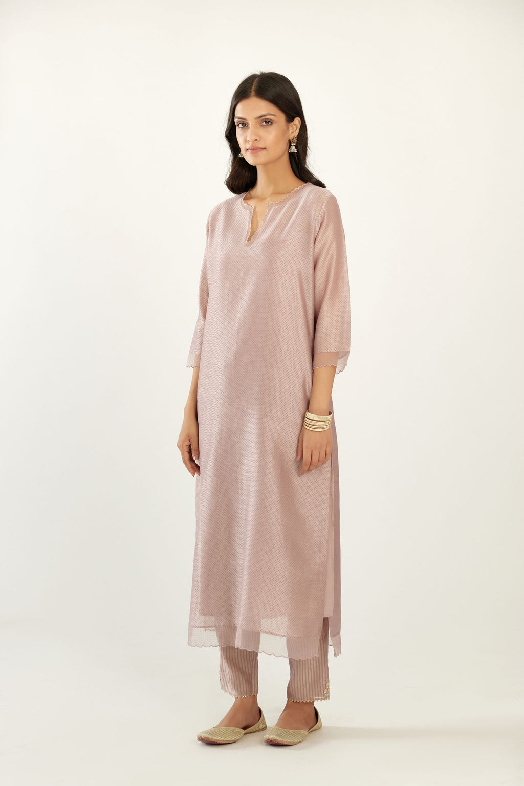 Lilac silk chanderi hand block printed straight kurta set, highlighted with scalloped organza at edges.