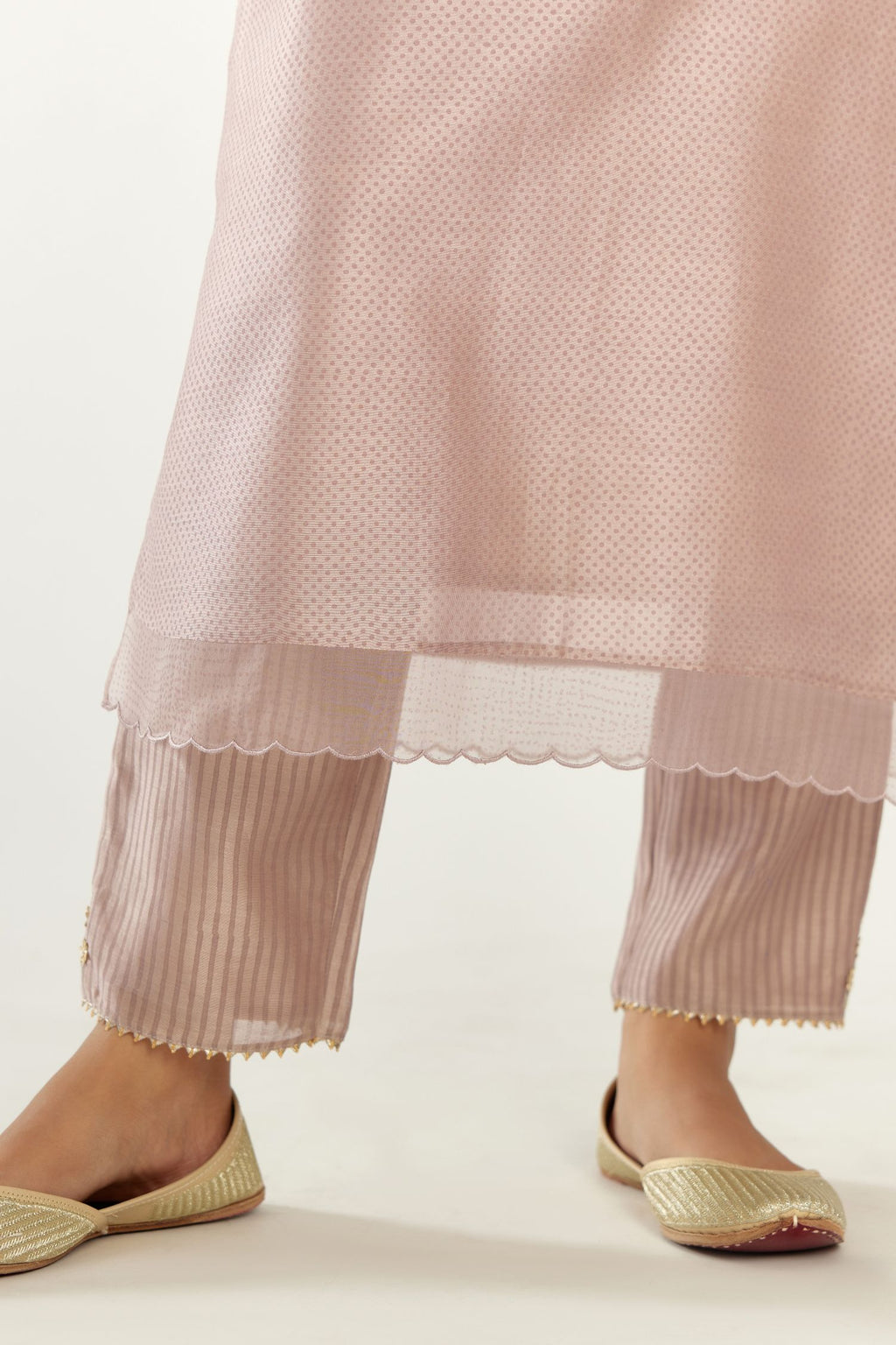 Lilac silk chanderi hand block printed straight kurta set, highlighted with scalloped organza at edges.