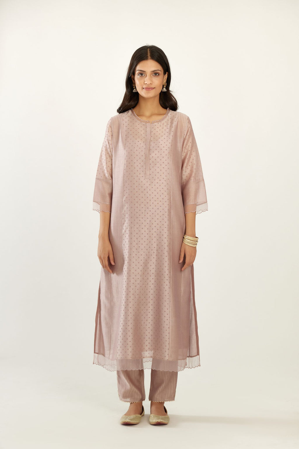 Lilac silk chanderi hand block printed straight kurta set with concealed button placket neckline, highlighted with scalloped organza at edges.