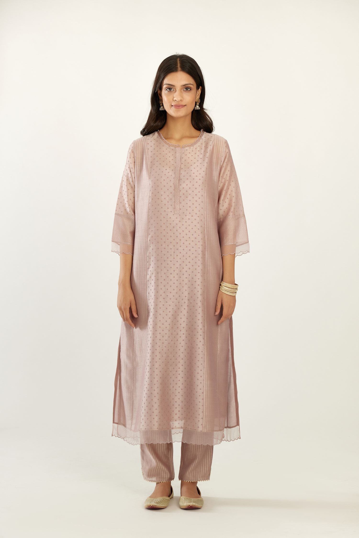 Lilac silk chanderi hand block printed straight kurta set with concealed button placket neckline, highlighted with scalloped organza at edges.