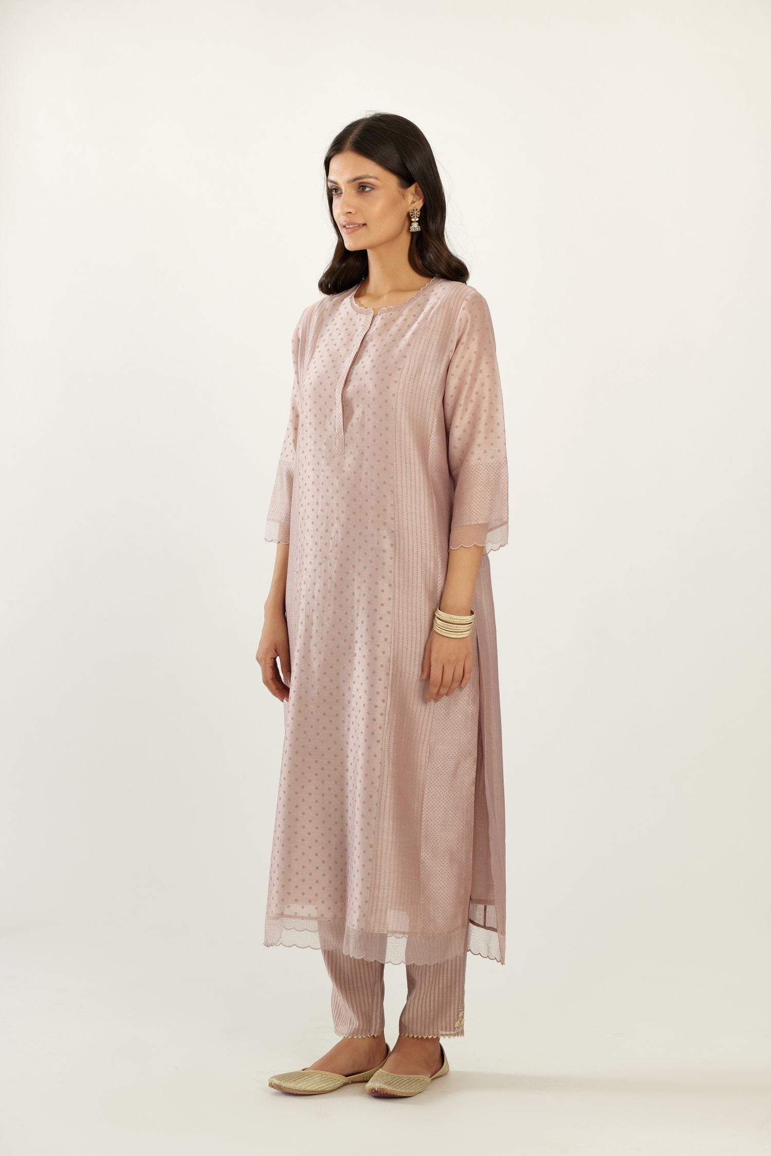 Lilac silk chanderi hand block printed straight kurta set with concealed button placket neckline, highlighted with scalloped organza at edges.
