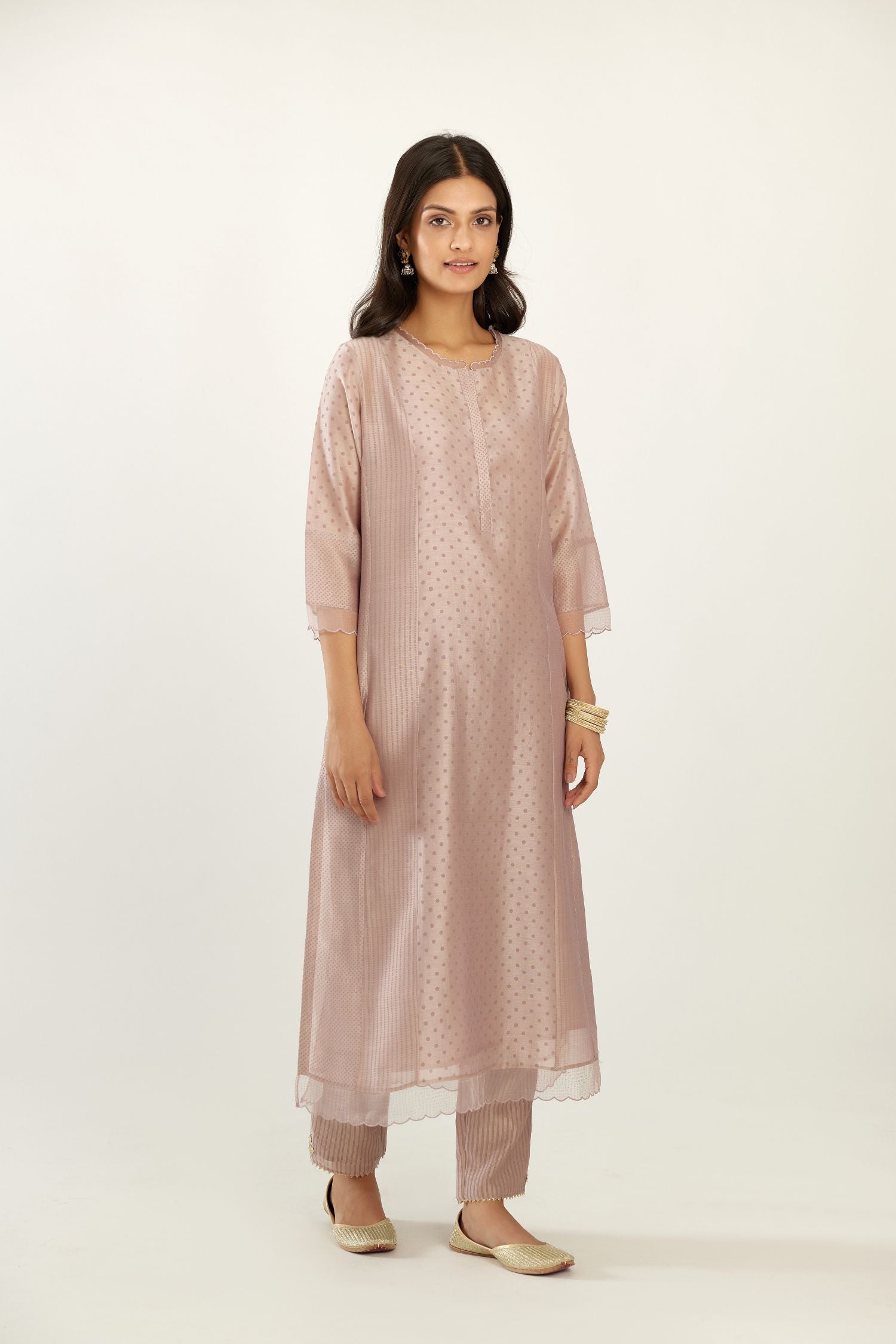 Lilac silk chanderi hand block printed straight kurta set with concealed button placket neckline, highlighted with scalloped organza at edges.