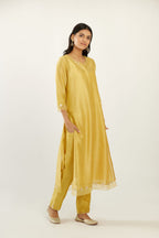 Yellow hand block printed silk chanderi kurta set with concealed button placket neckline, Highlighted with gota flower and scalloped organza at edges