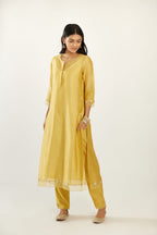 Yellow hand block printed silk chanderi kurta set with concealed button placket neckline, Highlighted with gota flower and scalloped organza at edges