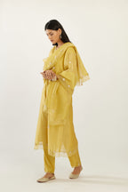 Yellow hand block printed silk chanderi kurta set with concealed button placket neckline, Highlighted with gota flower and scalloped organza at edges
