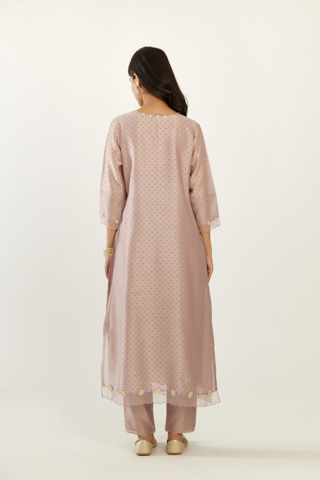 Lilac hand block printed silk chanderi kurta set with concealed button placket neckline, Highlighted with gota flower and scalloped organza at edges.