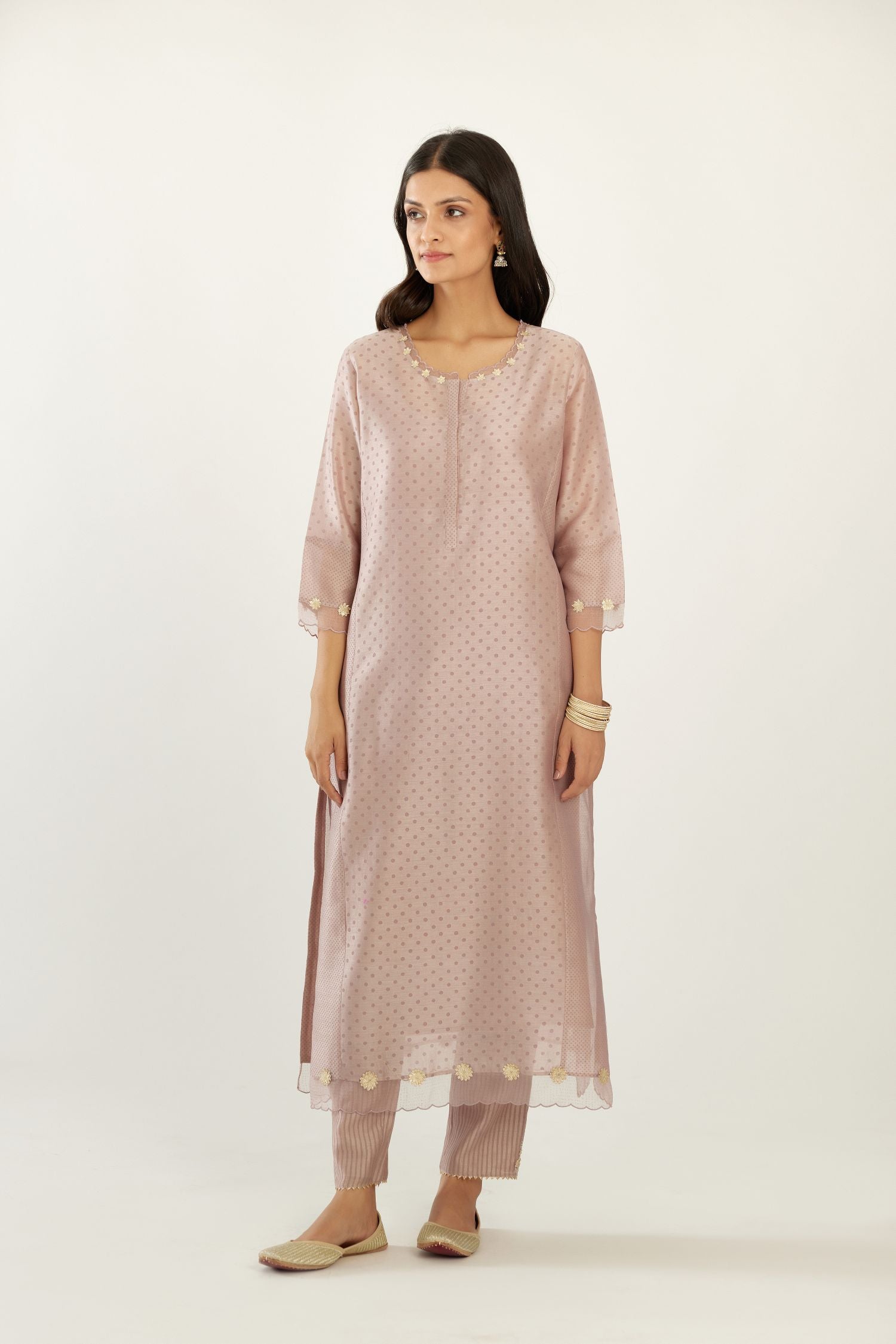 Lilac hand block printed silk chanderi kurta set with concealed button placket neckline, Highlighted with gota flower and scalloped organza at edges.
