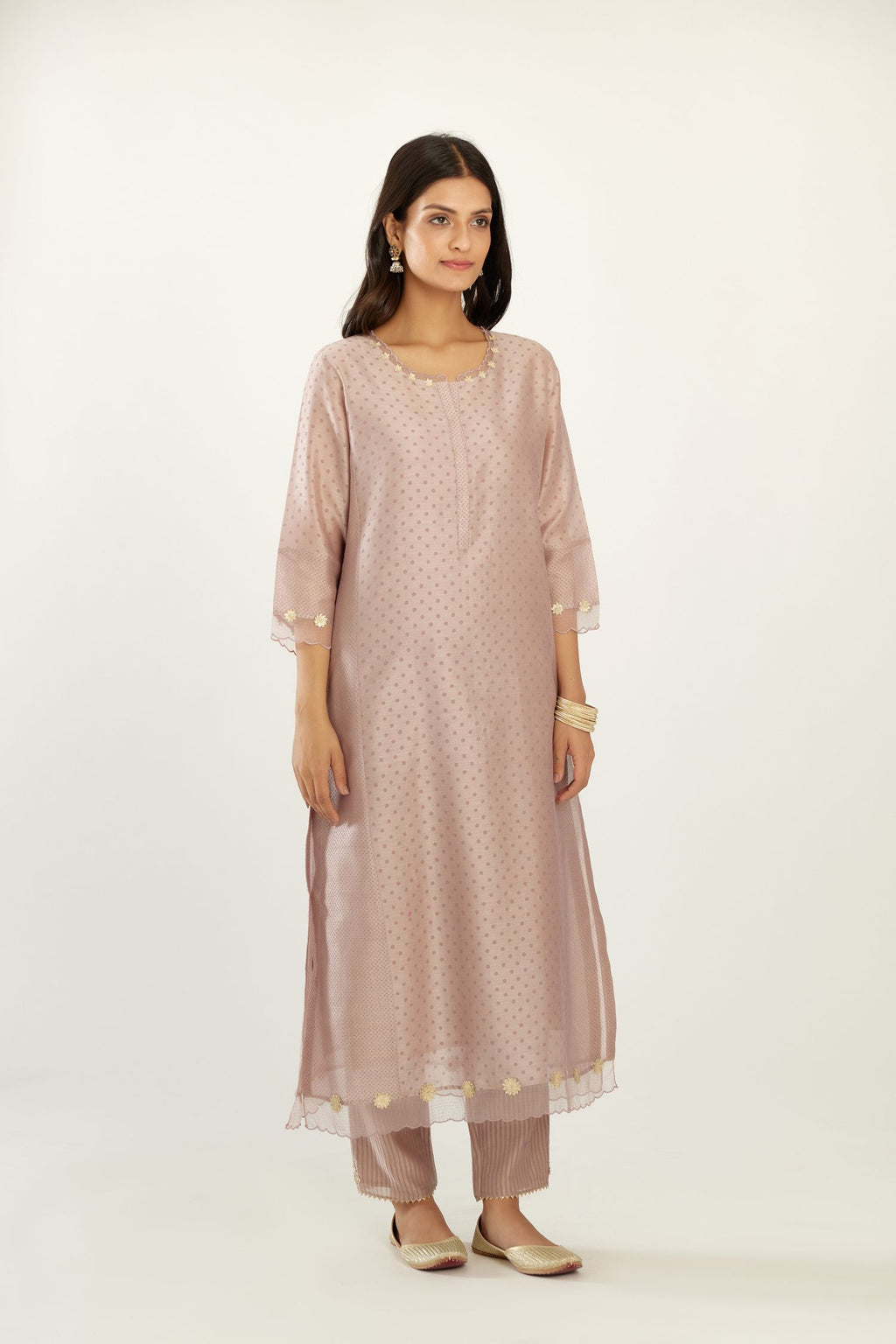 Lilac hand block printed silk chanderi kurta set with concealed button placket neckline, Highlighted with gota flower and scalloped organza at edges.