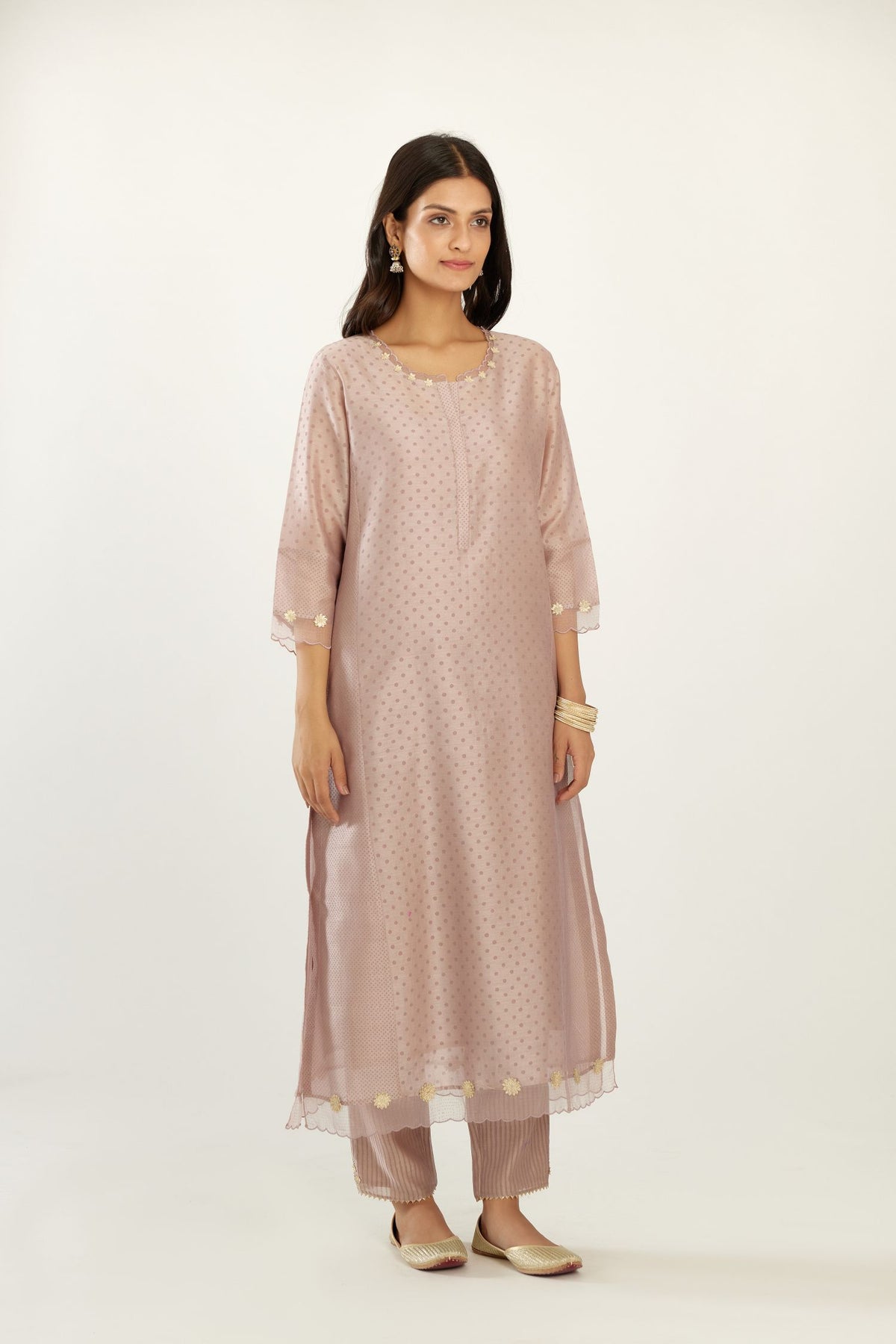 Lilac hand block printed silk chanderi kurta set with concealed button placket neckline, Highlighted with gota flower and scalloped organza at edges.