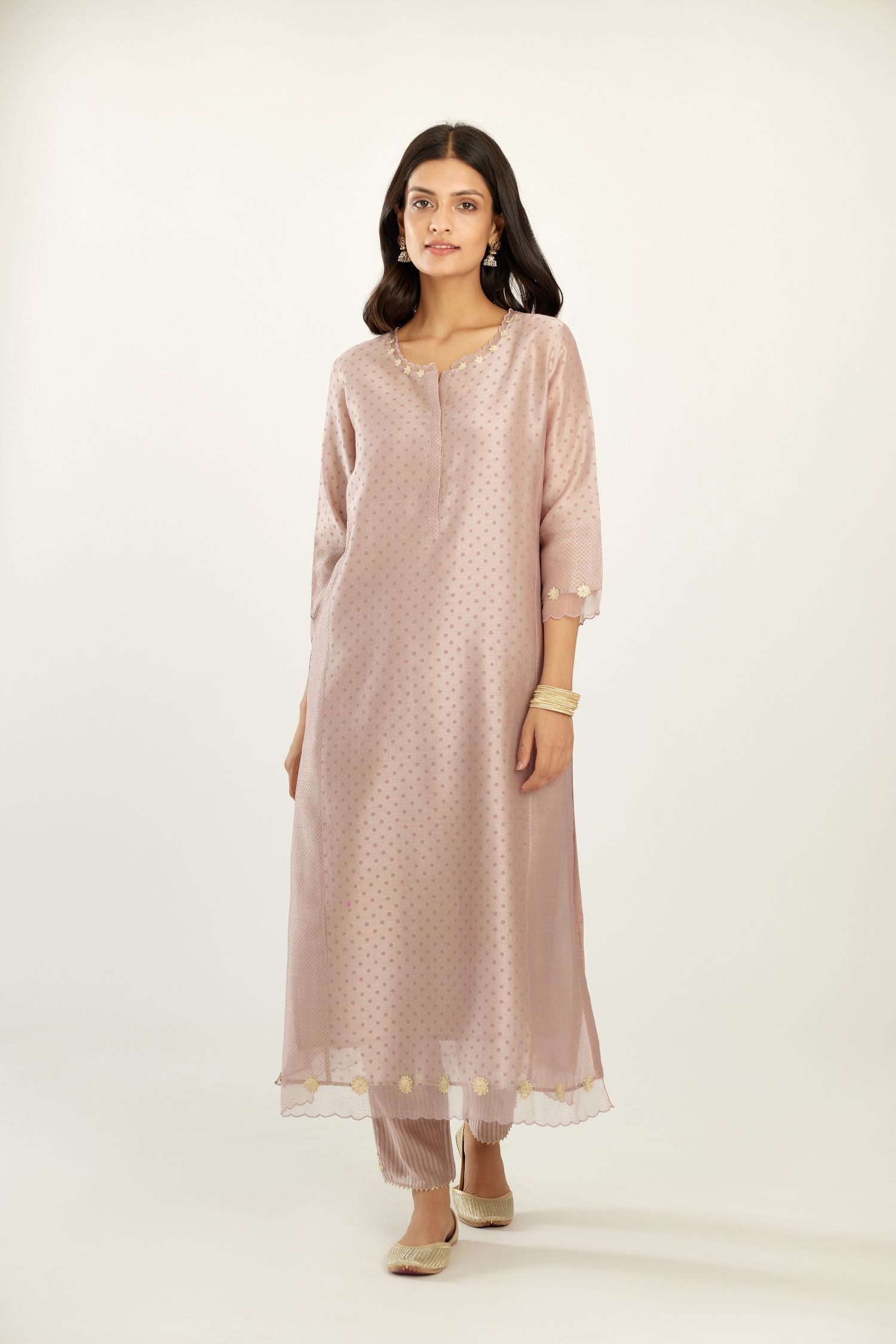Lilac hand block printed silk chanderi kurta set with concealed button placket neckline, Highlighted with gota flower and scalloped organza at edges.