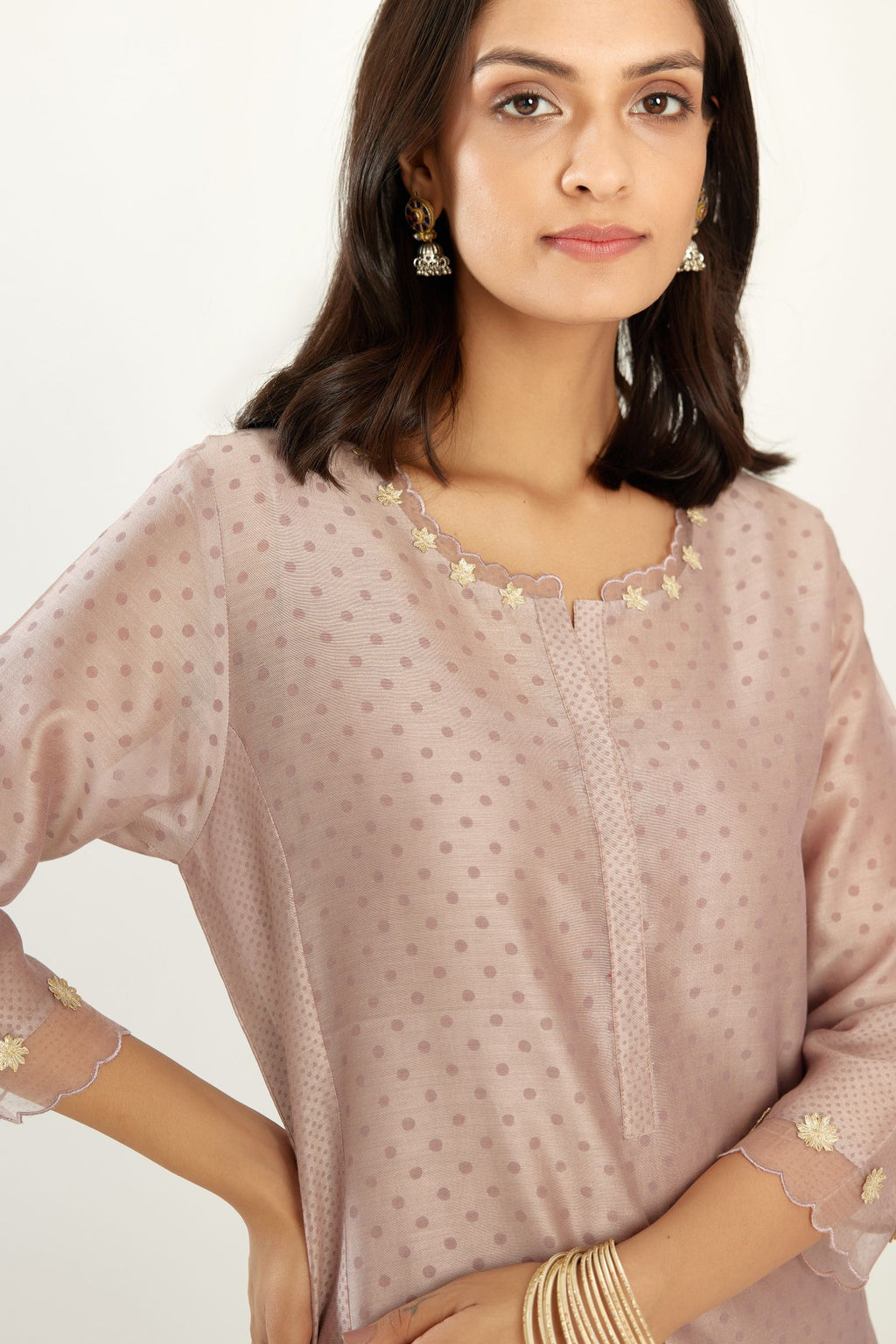 Lilac hand block printed silk chanderi kurta set with concealed button placket neckline, Highlighted with gota flower and scalloped organza at edges.
