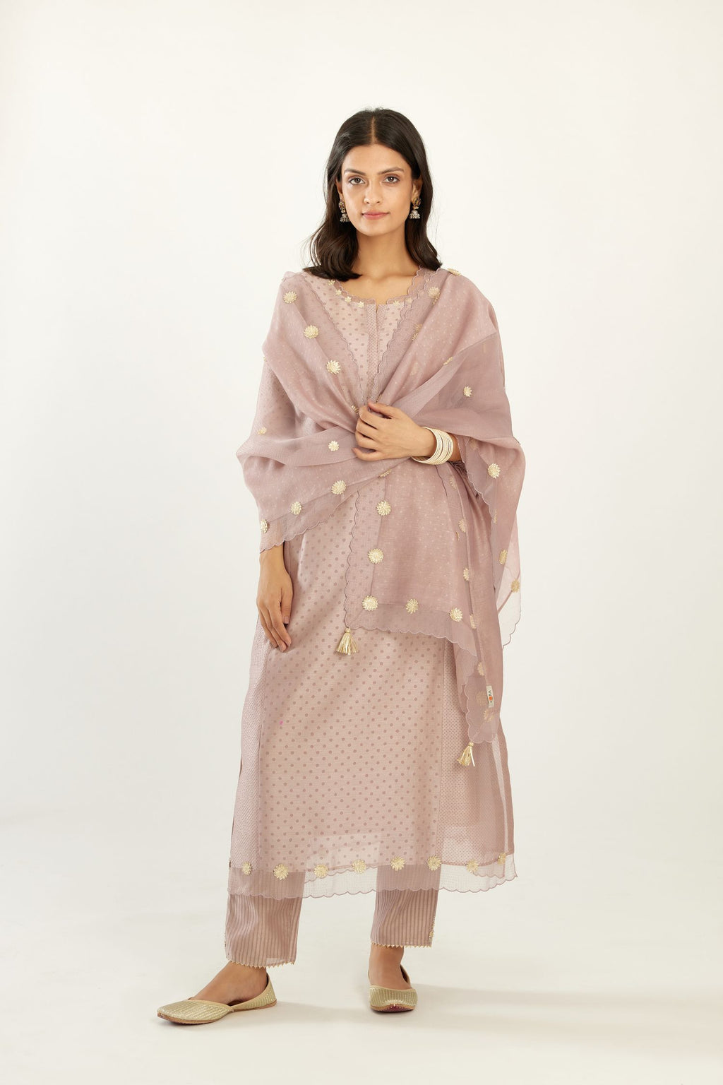 Lilac hand block printed silk chanderi kurta set with concealed button placket neckline, Highlighted with gota flower and scalloped organza at edges.
