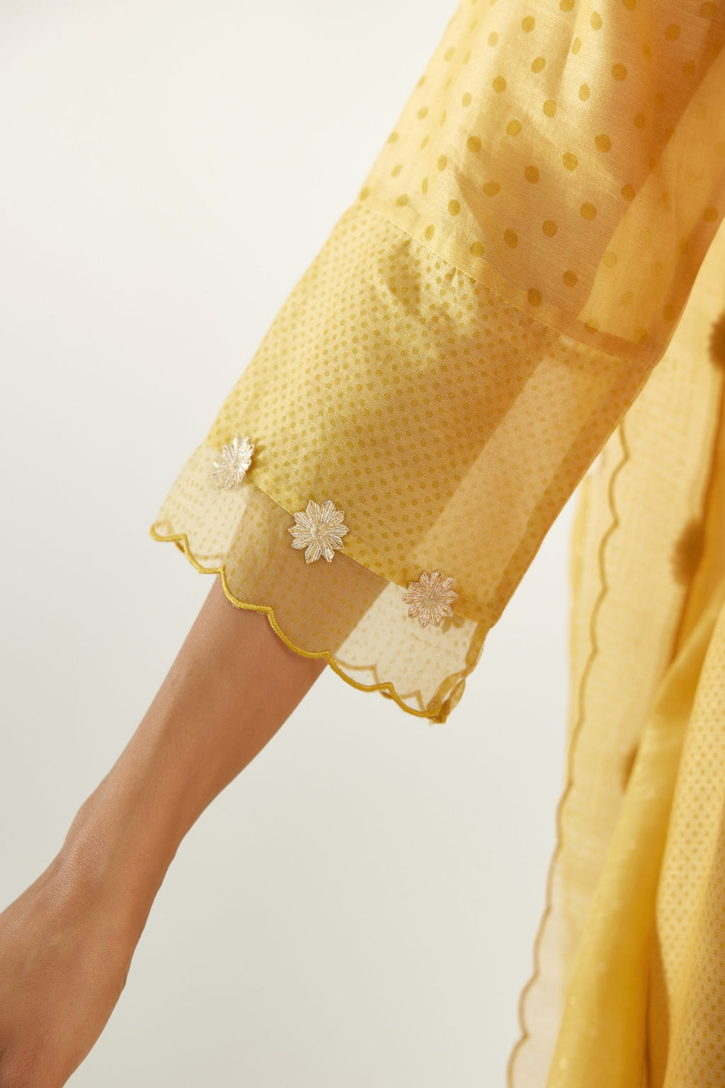 Yellow hand block printed silk chanderi easy fit short kurta set, highlighted with gota flower and scalloped organza at edges.